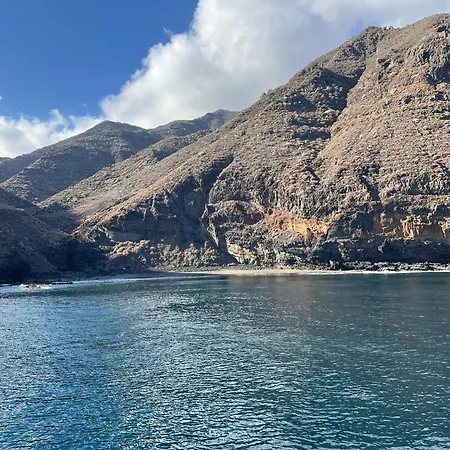 Yacht Experience Tenerife 24h Tour With Private Skipper & Private Hostess With Cocktails, Sandwiches, Free Minibar And Free Islandwide Pick-up And Return In A Tesla S Sportscar